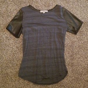 Grey tee with faux leather sleeves and trim